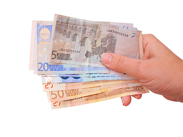 istock Hand holding euro bills, isolated in white 498443727