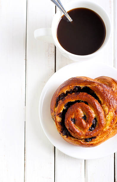 istock Bun and cup of coffee 498446309