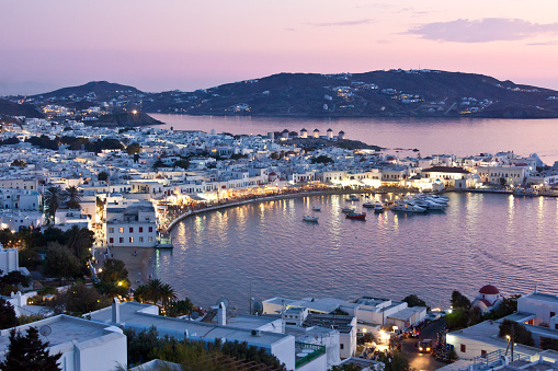 View from up to Mykonos town and harbor during sunset, nightshot,