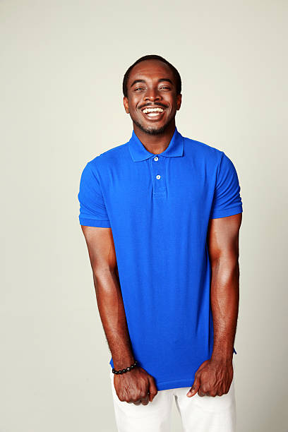 istock Laughing african man in blue t-shirt standing 498447671