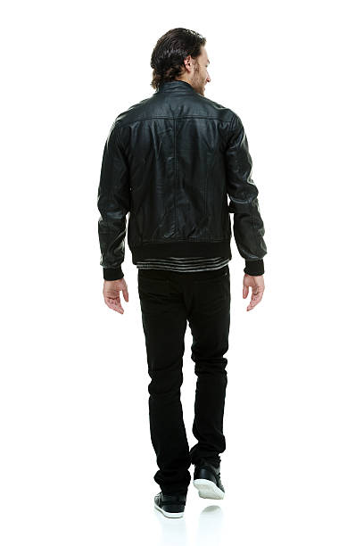 istock Rear view of man walking 498449679