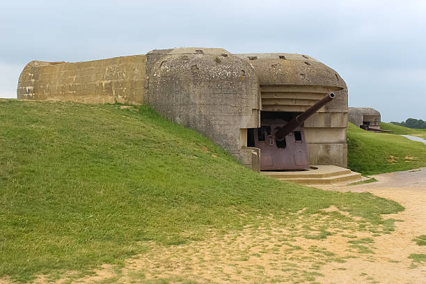 istock Old broken German bunkers of Atlantic Wall and artillery battery 498449763