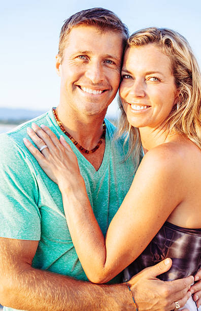 istock happy couple on a beach. 498449875