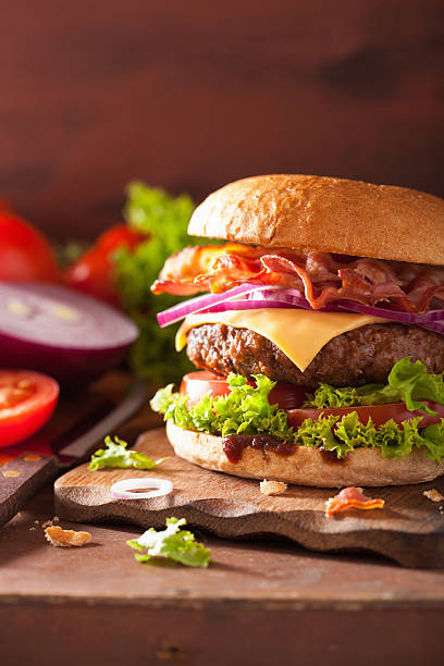 istock bacon cheese burger with beef patty tomato onion 498452724