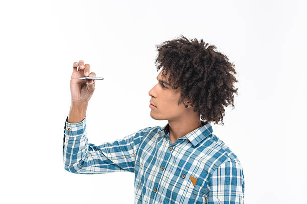 istock Afro american man looking on slim smartphone 498453352