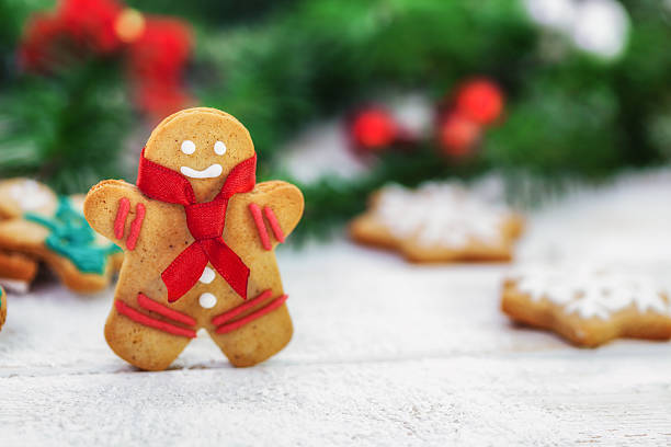 istock Christmas gingerbread  men cookies on white wooden board 498455854