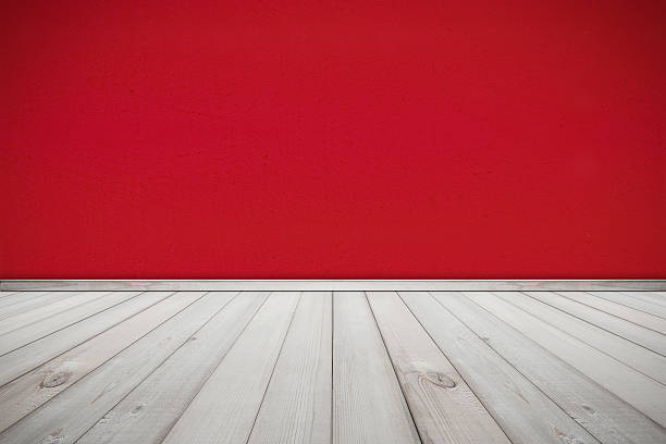 istock Cement Wall Painted Red Color and Wood Floor Texture Background 498456934