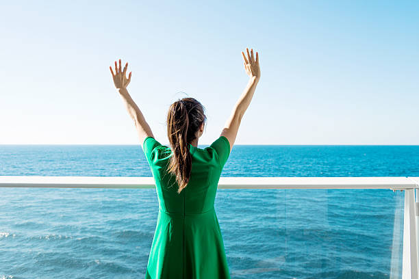istock Woman open arms on cruise 498458986