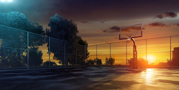 A streetball playground with a basketball hoop at sunrise with green trees as a background. The image is made in 3D.