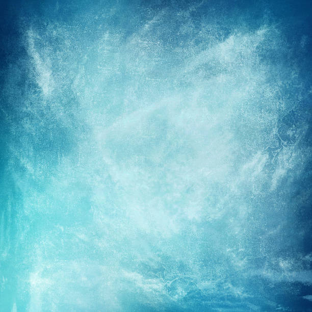 istock clouds on a textured vintage paper background, with grunge stains 498460163