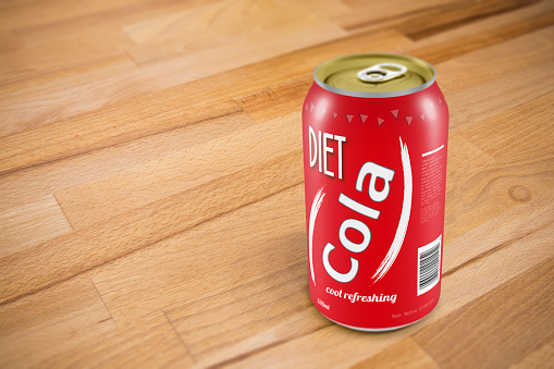 A generic can of diet cola on a wooden table. Original design with release.