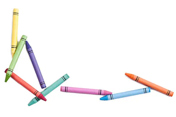Photo of colorful crayons isolated on white background. Studio shot