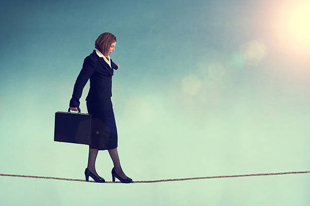 istock businesswoman on a tightrope 498462043