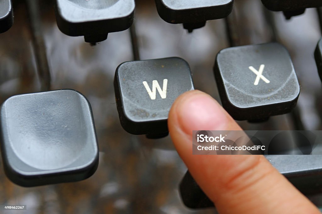 child press the W key symbol of the victory child press the W key symbol of the victory of an ancient mechanical typewriter Typewriter Stock Photo