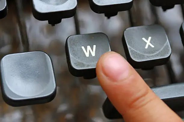 Photo of child press the W key symbol of the victory