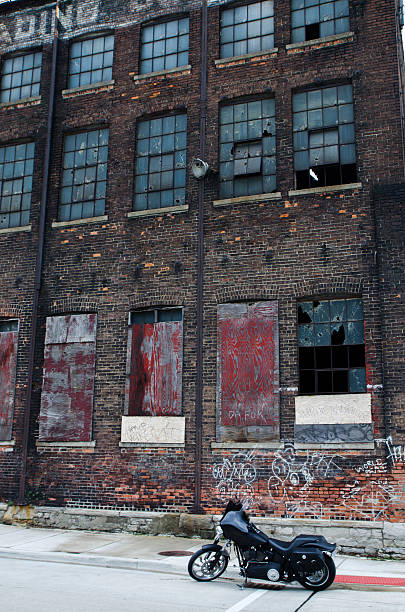 istock Motorcycle and abandoned factory 498462525