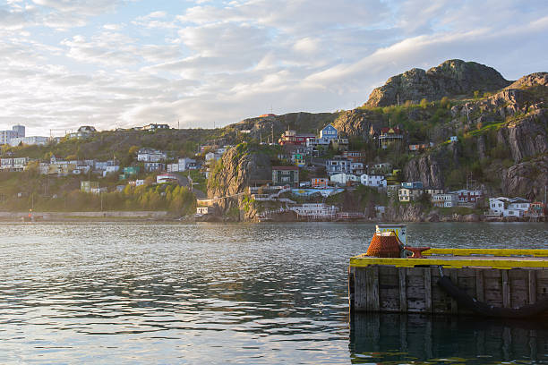 looking into St. John's Harbour looking into the harbour through the fishing village in fort amherst. newfoundland & labrador stock pictures, royalty-free photos & images