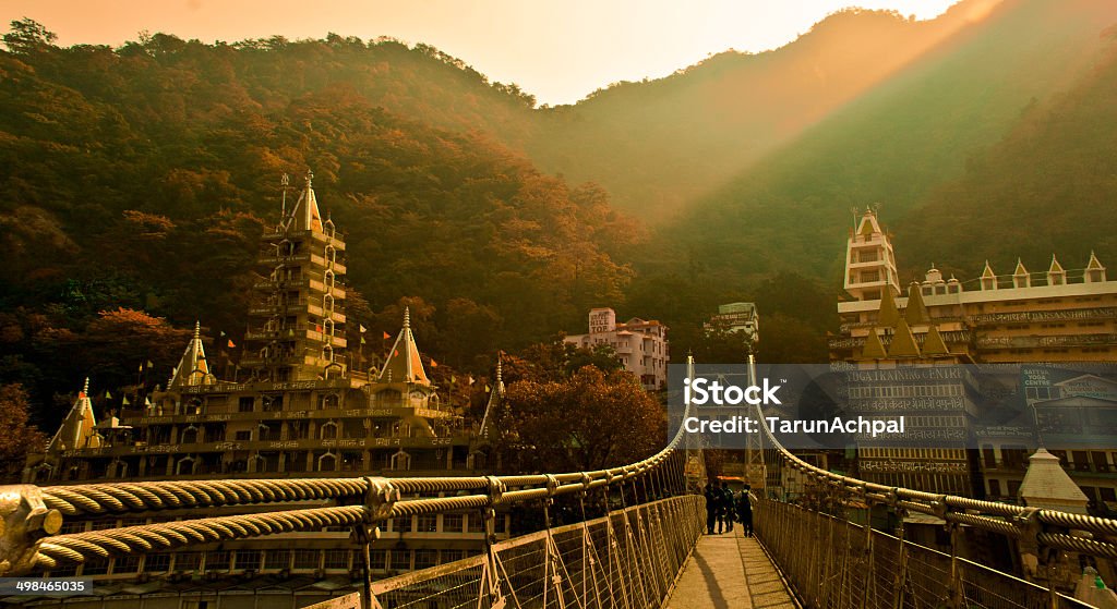 Path to Eternity Bridge connecting two hills separated by river Ganga, famously know as Ram Jhula, situated in Rishikesh, India. Its also the spiritual, Yoga and Meditation capital of the world. Rishikesh Stock Photo