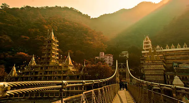 Bridge connecting two hills separated by river Ganga, famously know as Ram Jhula, situated in Rishikesh, India. Its also the spiritual, Yoga and Meditation capital of the world.