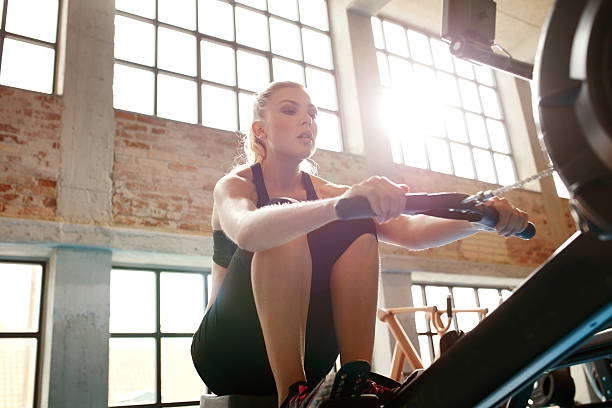 istock Female doing cardio workout in gym 498465128