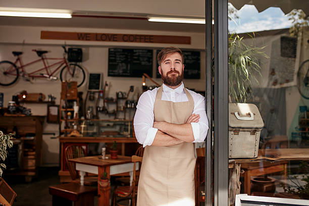 istock Proud cafe owner standing in the doorway 498465766