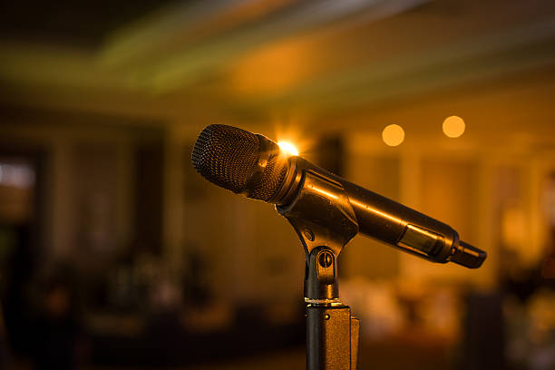 istock Wireless microphone stand on the stage venue with blur background 498467240