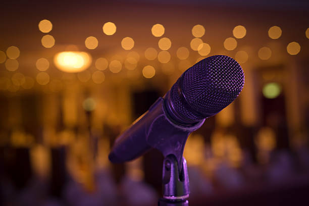 istock Wireless microphone stand on the stage venue with blur background 498467300
