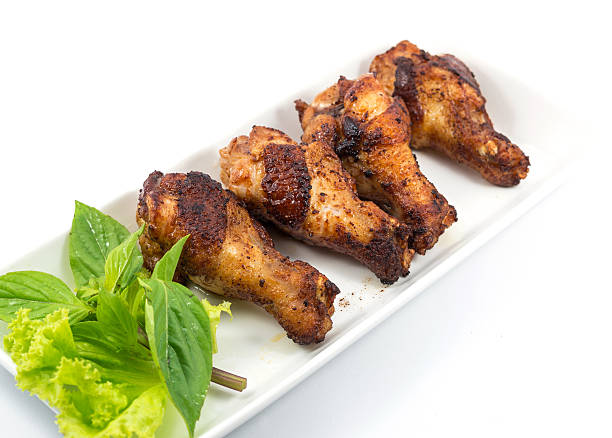 istock Grilled chicken legs with vegetables on the plate 498472689