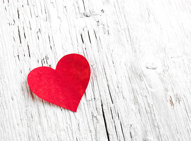 istock Heart on white wood background 498475153
