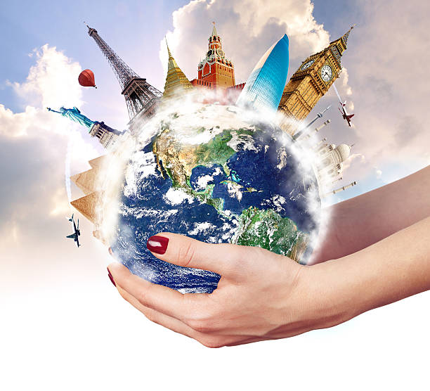 istock Travel around world with famous landmarks on globe in hands 498475491