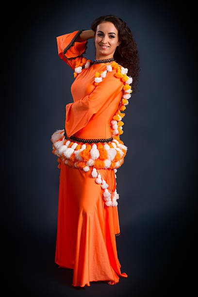 istock beauty dancer posing in traditional orange costume 498475657