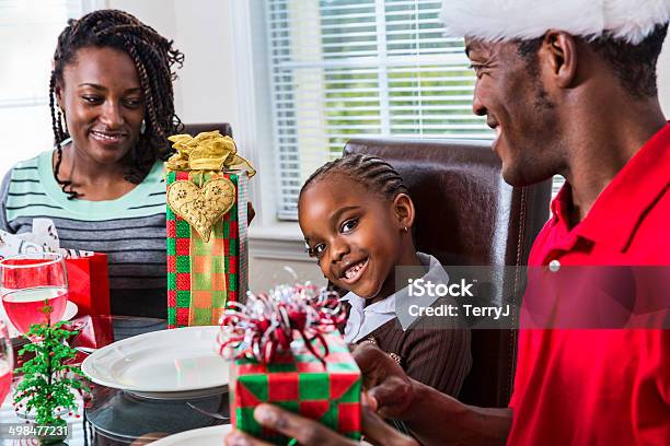 Family Celebrating Christmas Before Breakfast Stock Photo - Download Image Now - African-American Ethnicity, Christmas, Adult