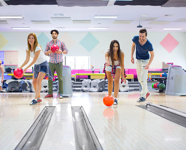 istock Cheerful Friends Bowling Together. 498488413