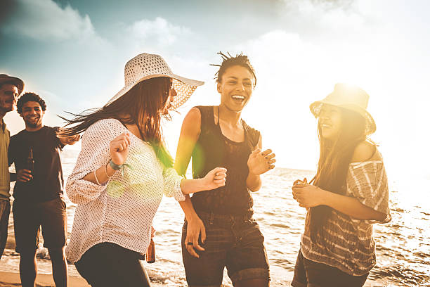 istock Group of friends dancing on the beach 498488483
