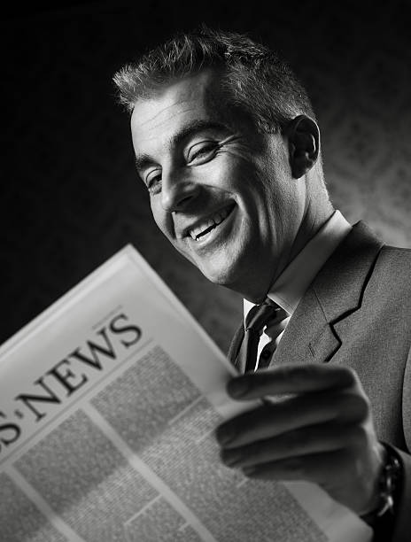 istock Businessman holding newspaper 498489163