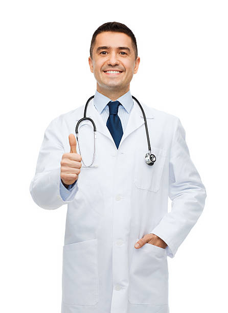 istock smiling doctor in white coat showing thumbs up 498490498