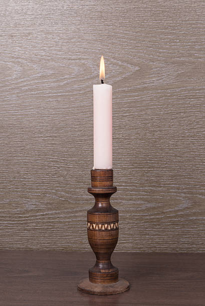 istock candle on wooden candlestick 498491050