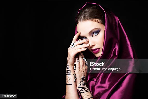 Beautiful Woman In Oriental Style With Mehendi Praying Stock Photo - Download Image Now