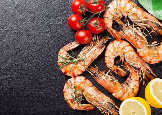 istock Grilled shrimps on stone plate 498492264