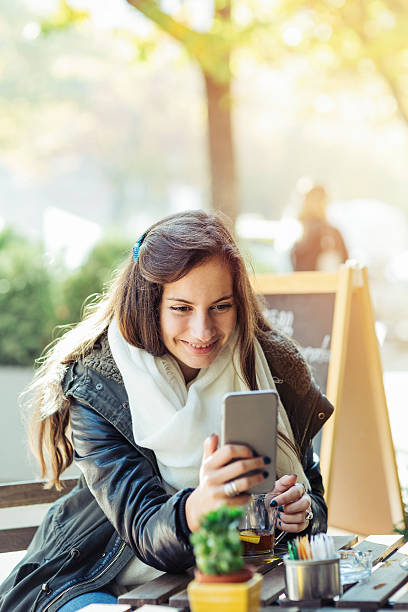 istock Girl texting on a cell phone 498493216