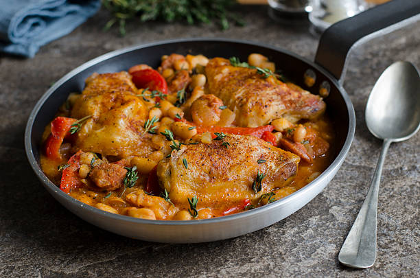 Spanish chicken with beans stock photo