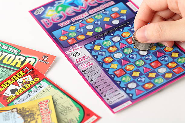 Scratching lottery ticket stock photo