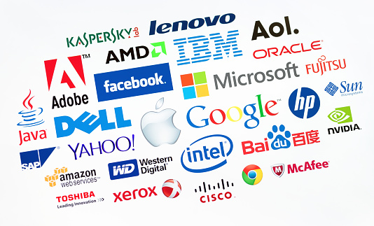 Kiev, Ukraine - May 19, 2014: A logotype collection of well-known world top companies  of computer technologies on a monitor screen. Include Google, Apple, Microsoft, IBM, Adobe, Intel and other logo.