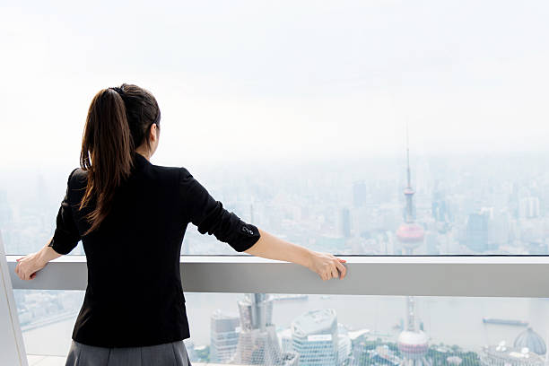 istock Businesswoman looking through the window 498494444