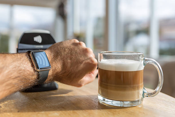 istock Paying With NFC Technology on Smart Watch in Coffee Shop 498494588