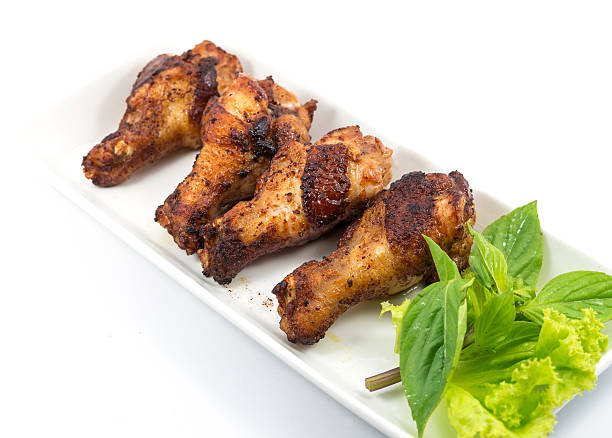 istock Grilled chicken legs with vegetables on the plate 498494655