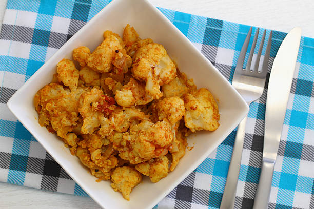 istock Cauliflower bhaji in white bowl, close up 498494883