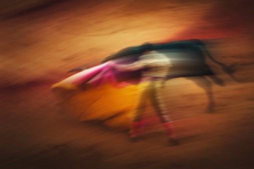 Bull and Matador, Bullfighting abstract - motion blur effect