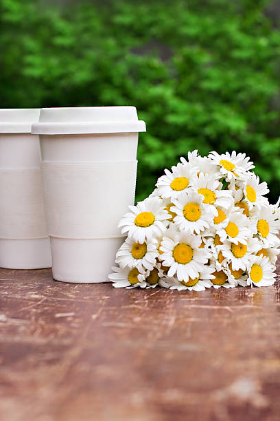 istock coffee and a bouquet of daisies 498495531