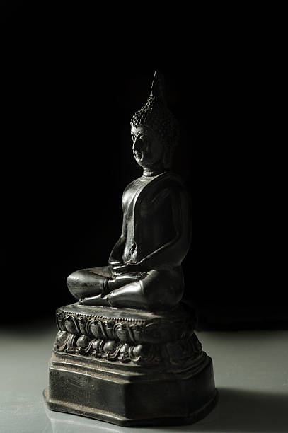 istock Low key light of Buddha statue. 498497840